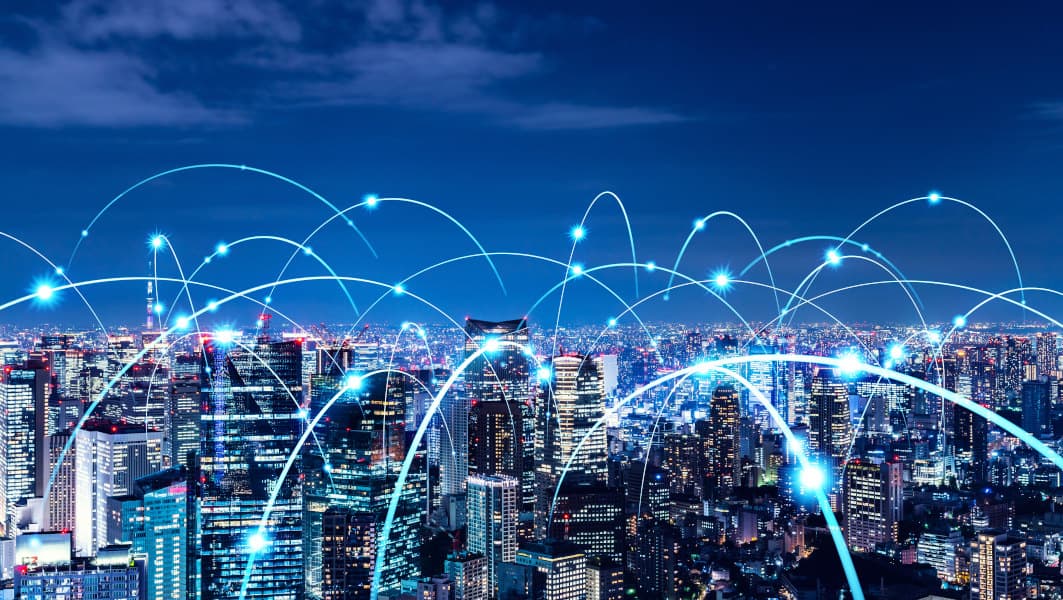 Stylized city view with light arcs symbolizing data connections