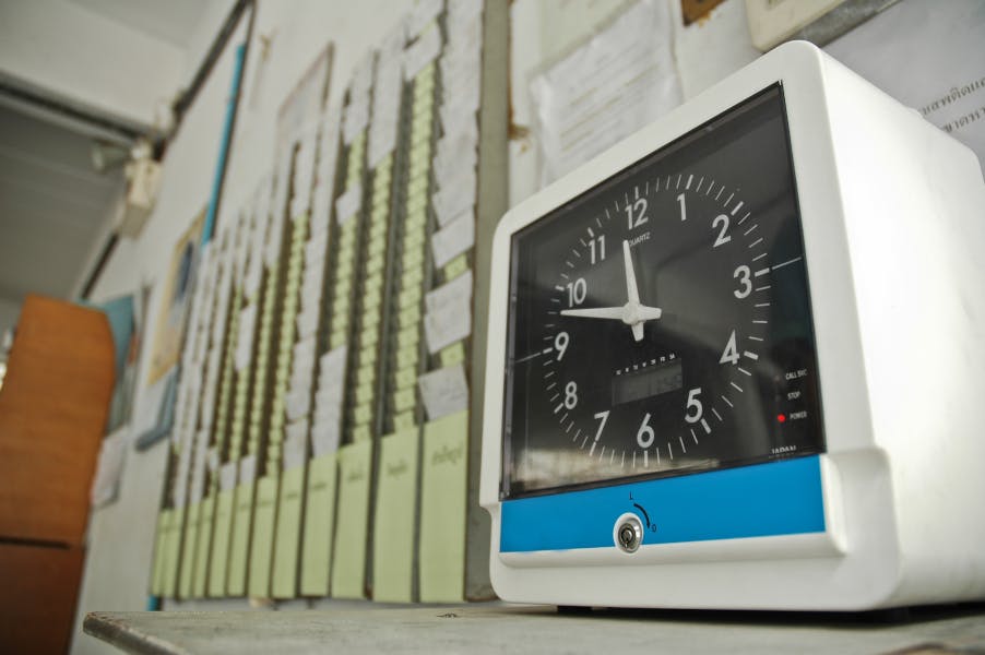 Time clock in front of card board